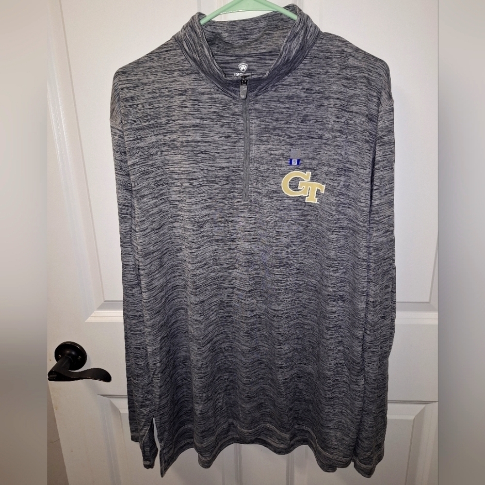 A Top of the World Georgia Tech 1/4 zip jacket in a men's size XL. NWOT.